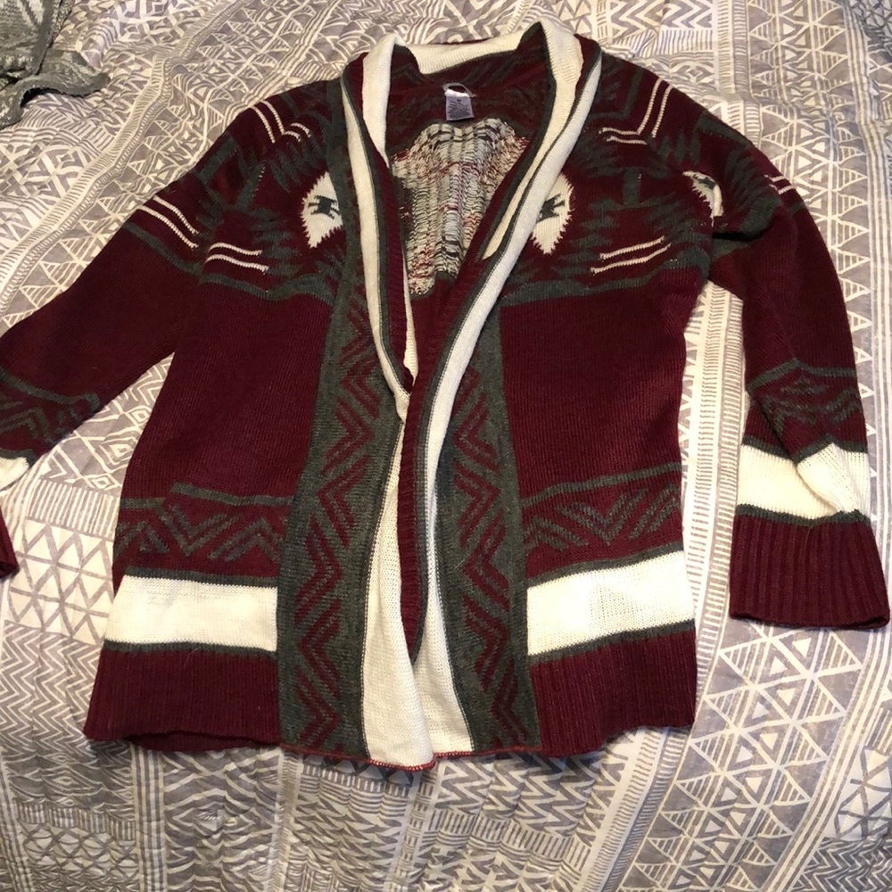 Maroon sweater with gray and white designs